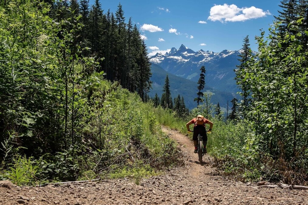 Mountain biking A person biking through mountainous terrain